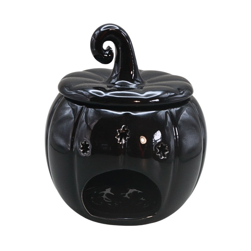 black pumpkin oil burner on white background