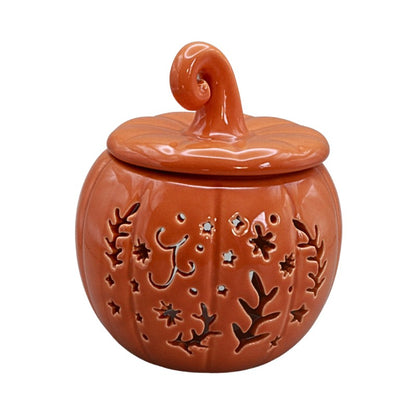 orange ceramic pumpkin on a white background