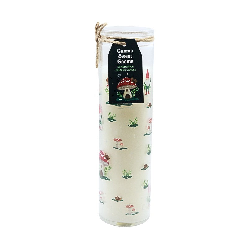 Decorative candle with gnome-themed design and label on a white background