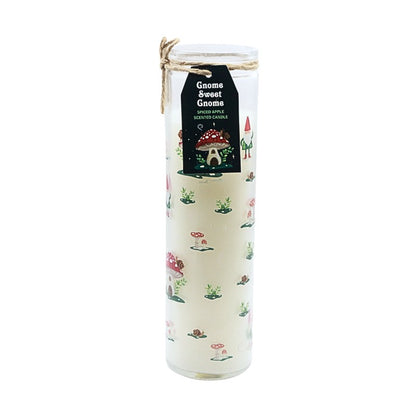 Decorative candle with gnome-themed design and label on a white background