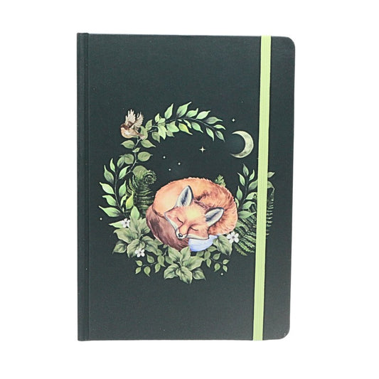 Notebook with a fox illustration on a black background