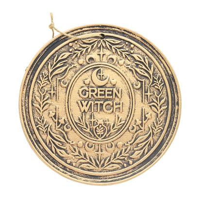 Decorative wall hanging sign with 'Green Witch' text on a white background