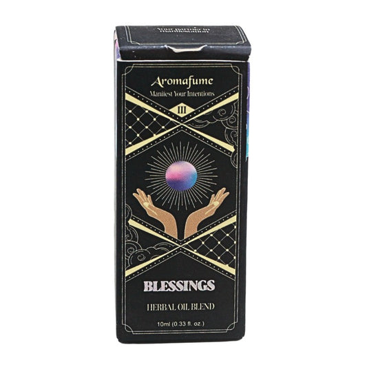 A rectangular black box labeled 'Aromafume Blessings Herbal Oil Blend' with gold decorative lines, a crystal ball illustration, and two raised hands, shown on a plain white background.