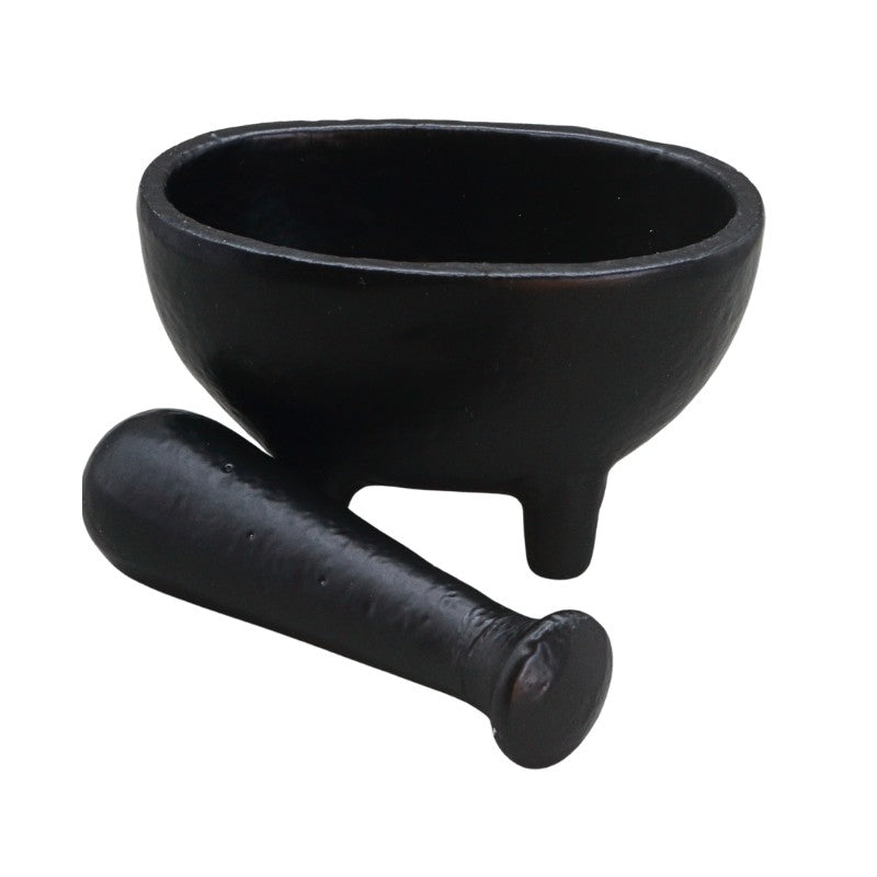 A black wrought iron mortar and pestle set on a plain white background.
