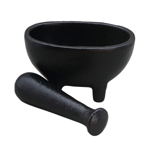 A black wrought iron mortar and pestle set on a plain white background.