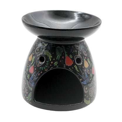 Decorative oil burner with colorful vegetable pattern on a white background