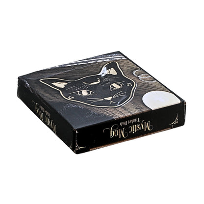A square black product box with a stylized cat face illustration and gold decorative text reading 'Mystic Mog' on a plain white background.