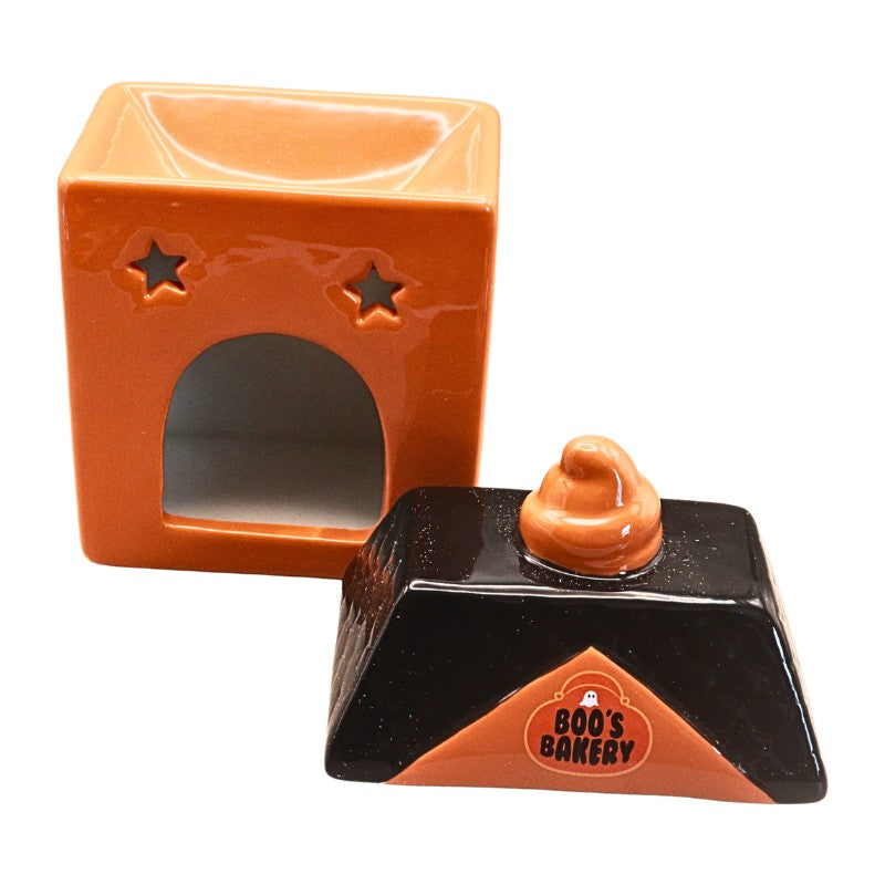 A Halloween-themed ceramic candy dish shaped like a chocolate bar, featuring a black body with an orange triangular front panel, a small orange top, and a separate orange lid with star cutouts, shown on a white background.