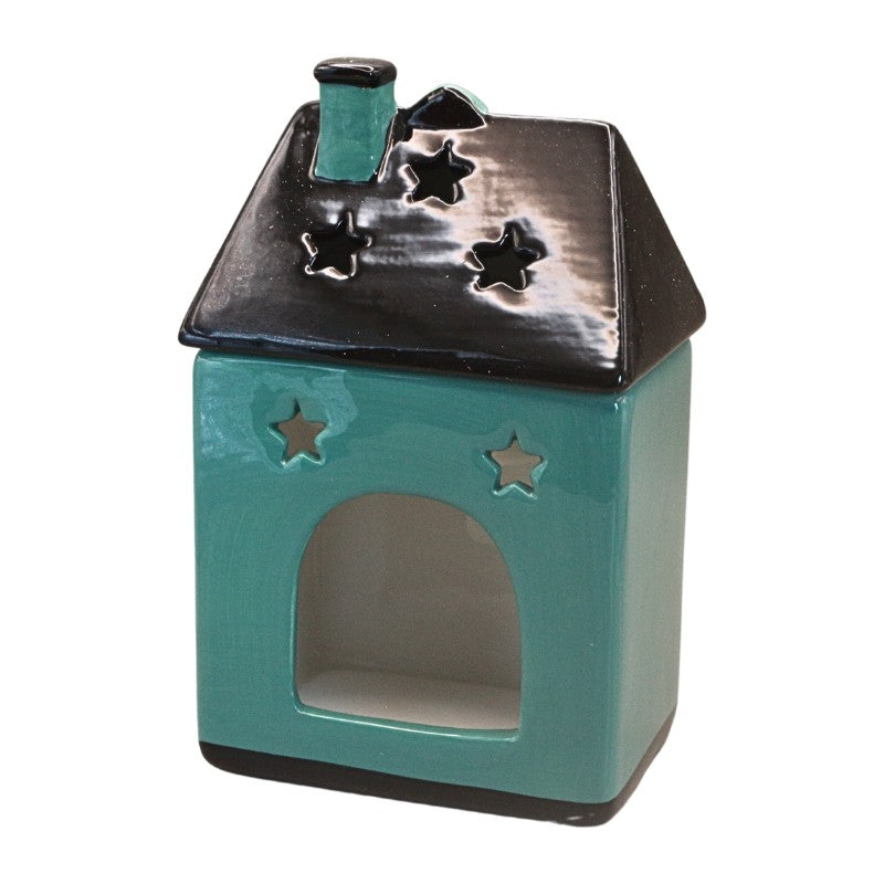 A small house-shaped ceramic candle holder or diffuser in glossy teal with a black roof and star-shaped cutouts, shown on a plain white background.
