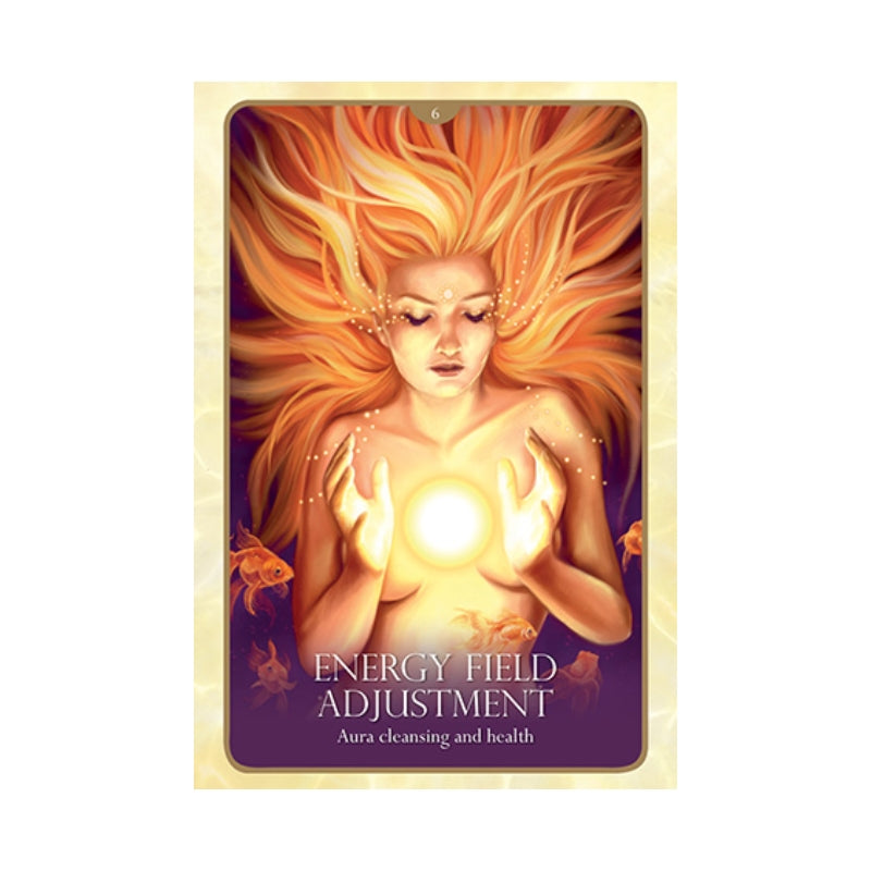 An oracle card titled 'ENERGY FIELD ADJUSTMENT' with the subtitle 'Aura cleansing and health'. The card features an illustration of a woman with glowing orange hair and hands holding a bright light, set against a dark purple background with gold fish details.