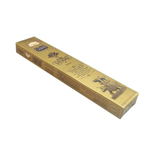 Angled view of the gold Parimal Pure Sandal incense box showing the front artwork and side panel with barcode.