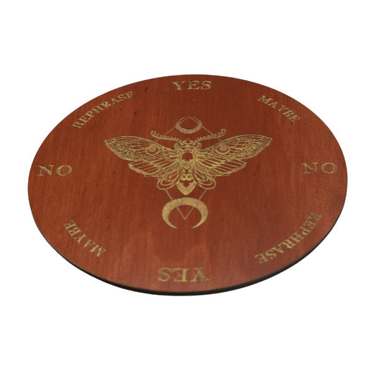 round wooden board painted maple with a gold death's head moth design on a white background