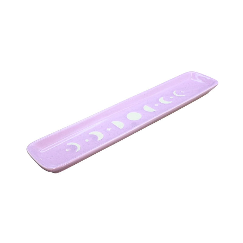 A light purple rectangular tray with rounded corners, featuring a row of white moon phases and stars printed along the top surface, set against a plain white background.