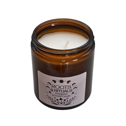 Amber glass candle with a label on a white background
