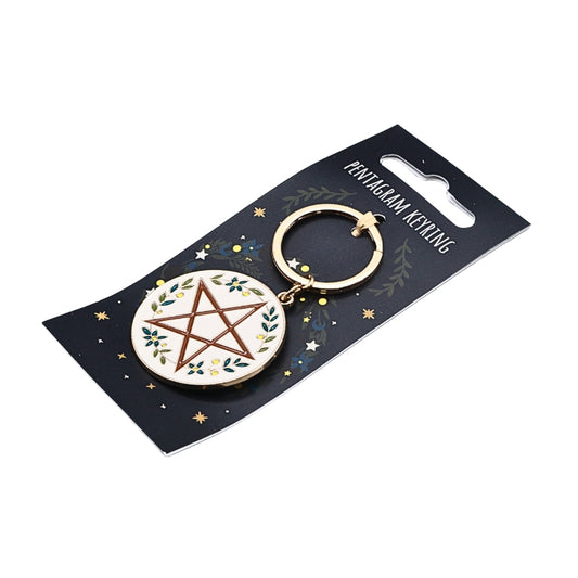 A pentagram keyring charm on a black display card. The circular charm has an off-white background with a brown pentagram design and small green and yellow floral accents.