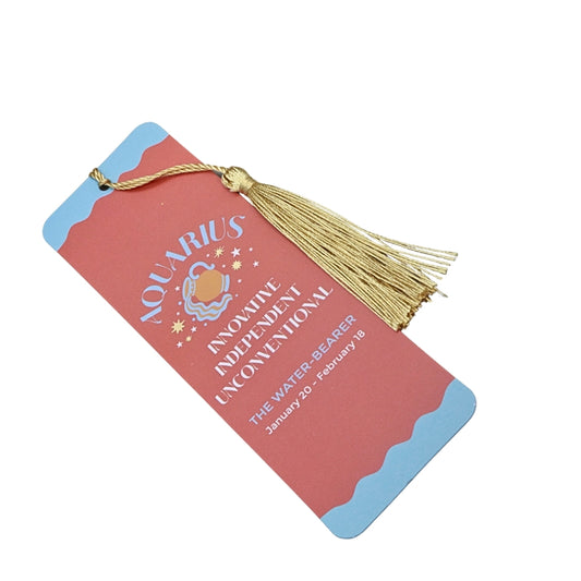 orange and blue bookmark with gold tassel and white and blue writing