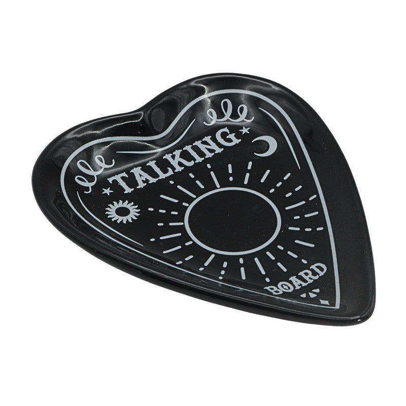 black and white ceramic planchette shaped trinket dish