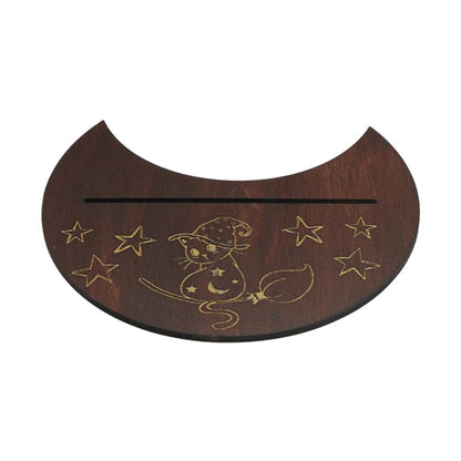 Wooden crescent moon-shaped plaque with engraved cat and star design on a white background
