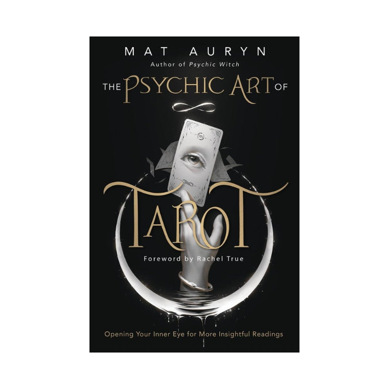 black book cover featuring a hand holding a tarot card and the title "The Psychic Art of Tarot" with the name "Mat Auryn"
