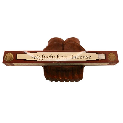 pk of natural tibetan dhoop incense on a pair of open wooden carved hands