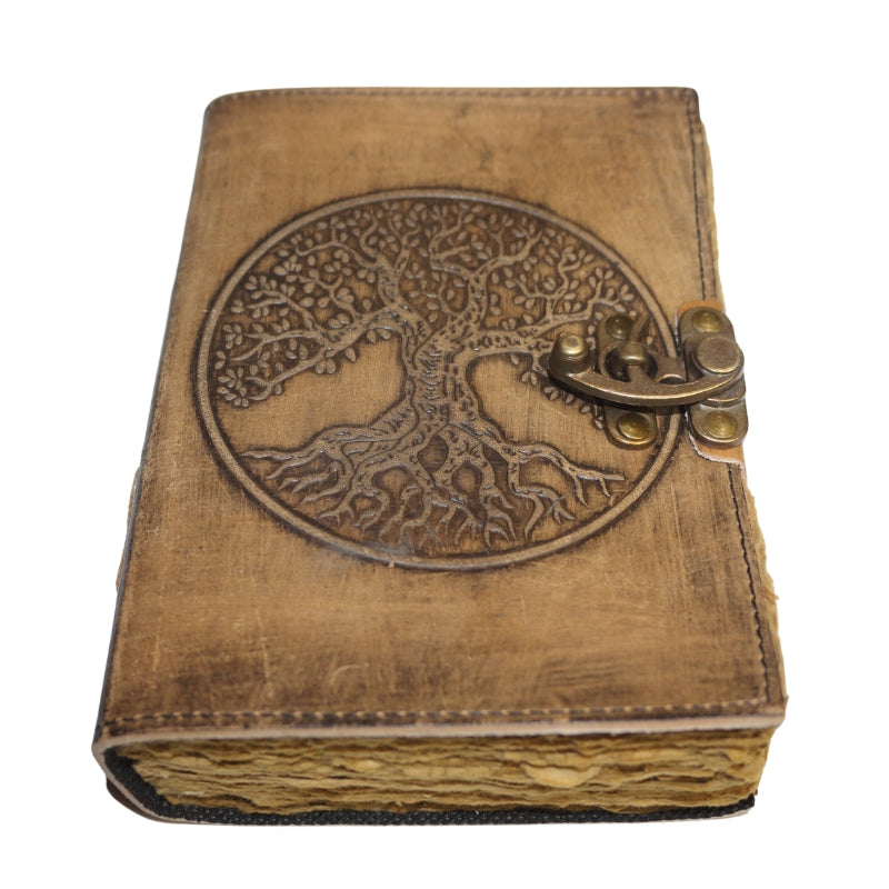 Antique style brown leather journal with the tree of life on the cover and a brass closure. Inside contains plain "antiqued" pages 