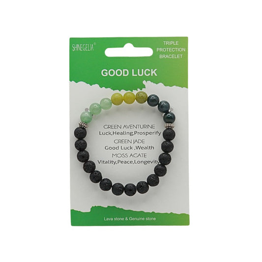 Bracelet with black beads on a green and white packaging labeled 'Good Luck'.