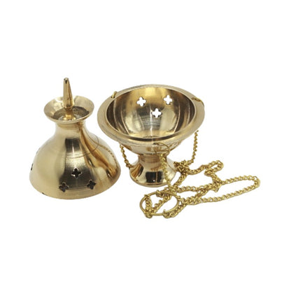 Gold-colored incense burner with a chain on a white background
