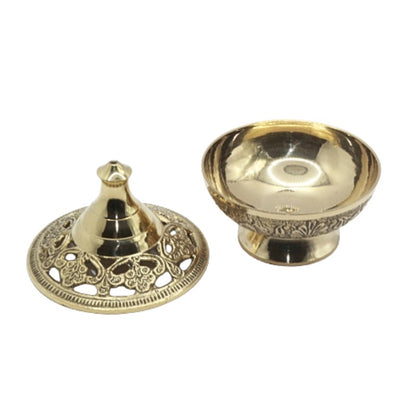 Two parts of a gold-coloured incense burner  on a white background