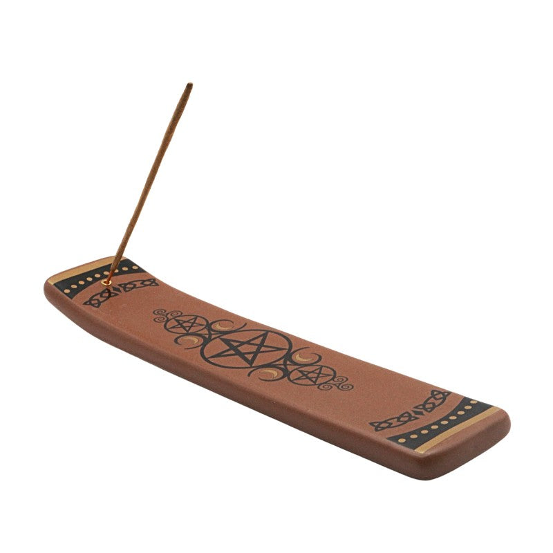 Ceramic incense burner with pentagram design on a white background