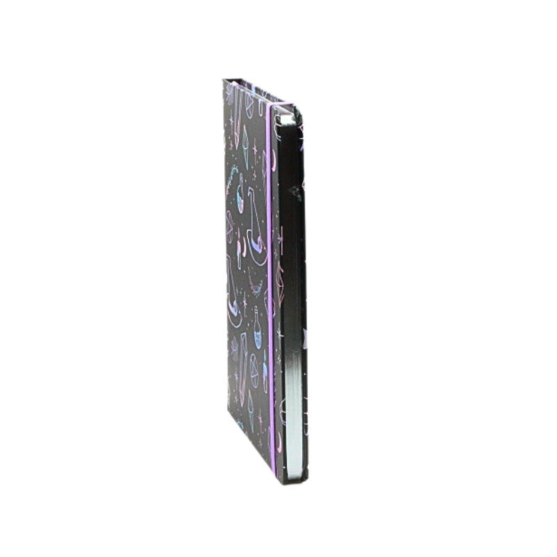 Side view of notebook with crystal witch pattern and silver edging
