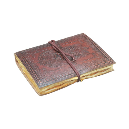 brown leather journal, embossed with image of a hand, with a brown tie, on a white background