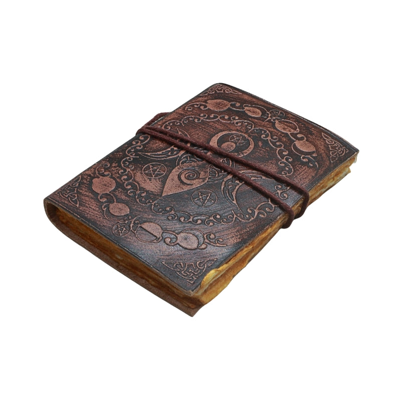 leather journal with brown tie and embossed spiral goddess design, on a white background