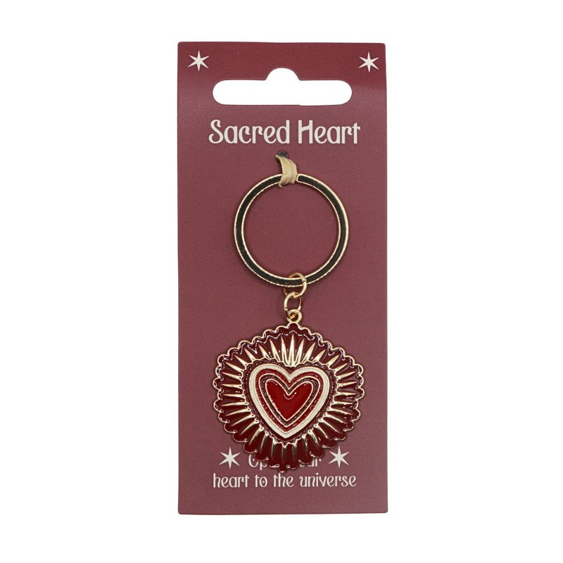 Keychain with 'Sacred Heart' design on a red card
