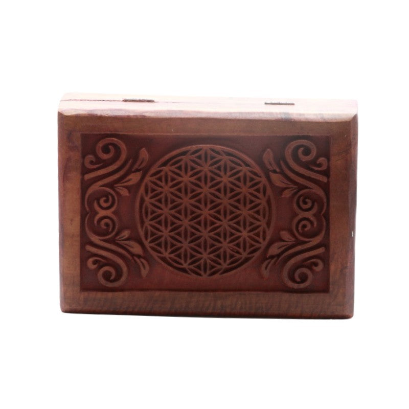 carved wooden box with flower of life design carved on top